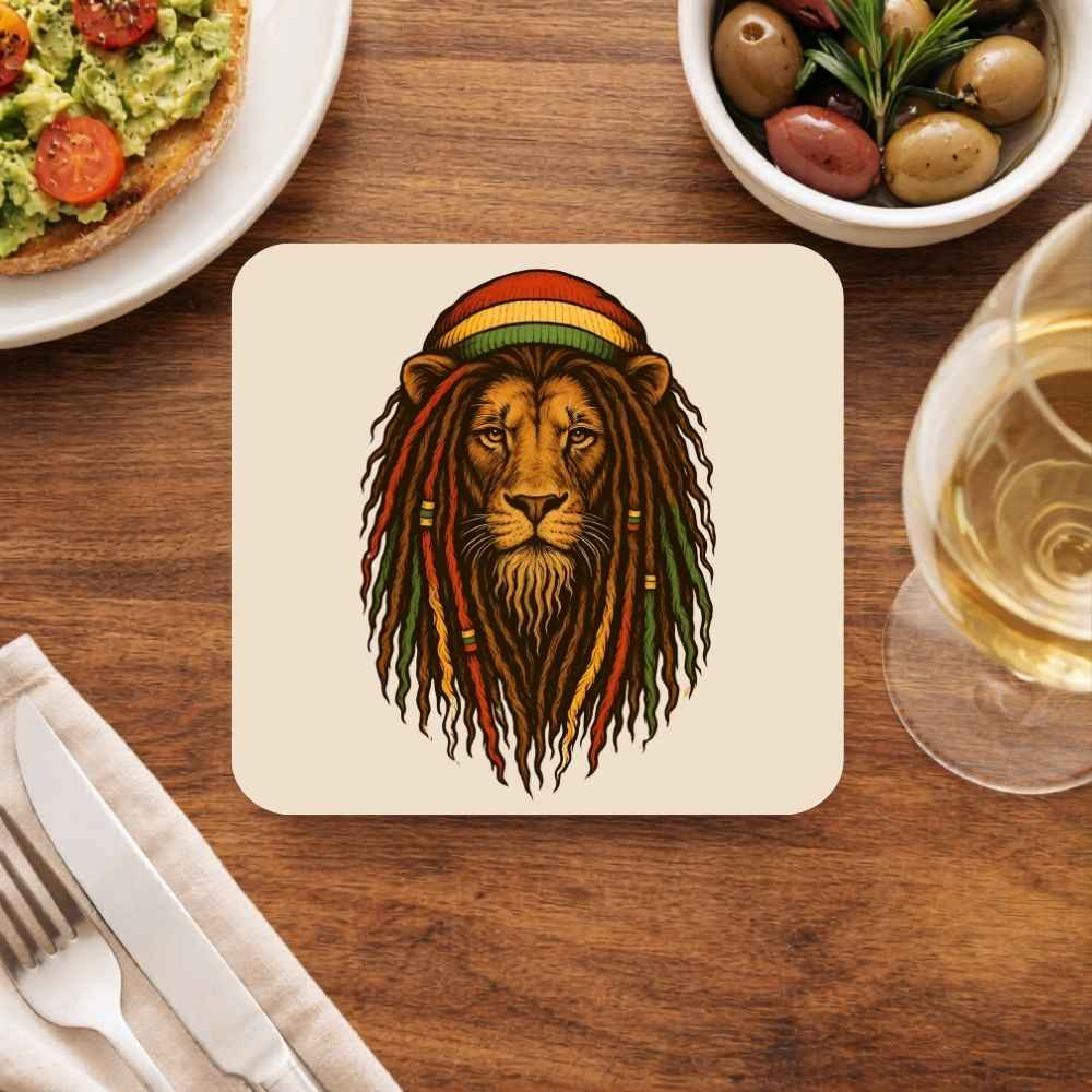 Coaster with a lion wearing a Rastafarian hat on a wooden table with food and drink. Bob Marley Gift Merch The Banyan Tee