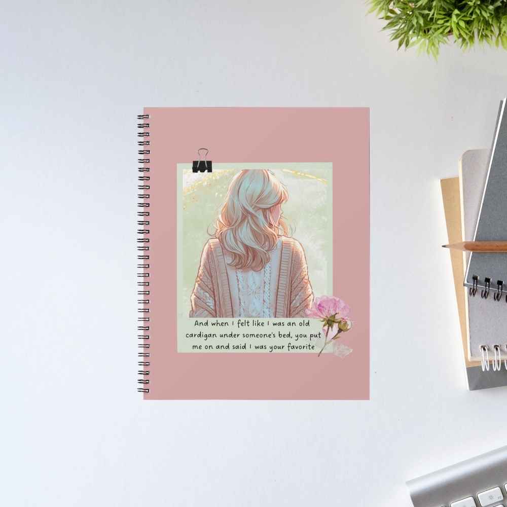 Taylor Swift Old Cardigan spiral notebook with an illustrated woman in a knit cardigan, a pink peony and the 'old cardigan under someone's bed' lyric on a dusty rose cover – The Banyan Tee