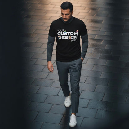 Man wearing a black long-sleeve shirt with customizable text design on a brick path.