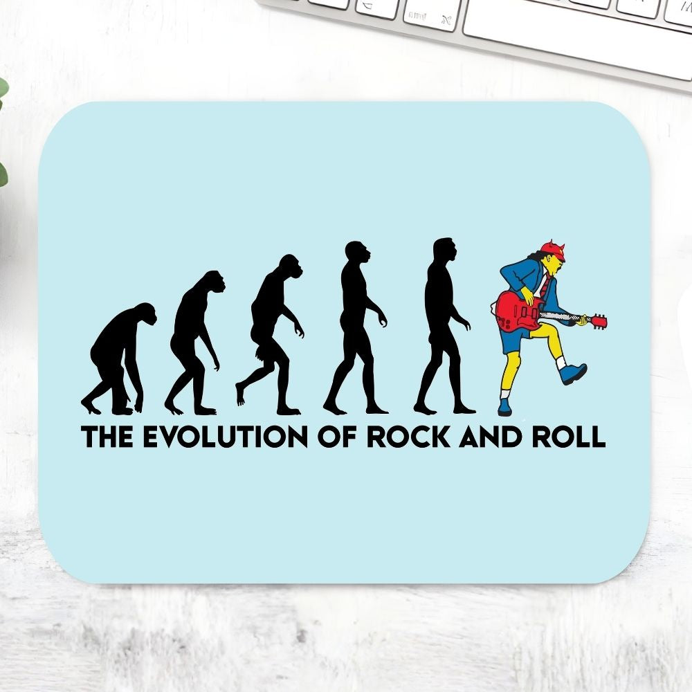 Mouse pad with 'The Evolution of Rock and Roll' design on a light blue background AC/DC Mousepad The Banyan Tee