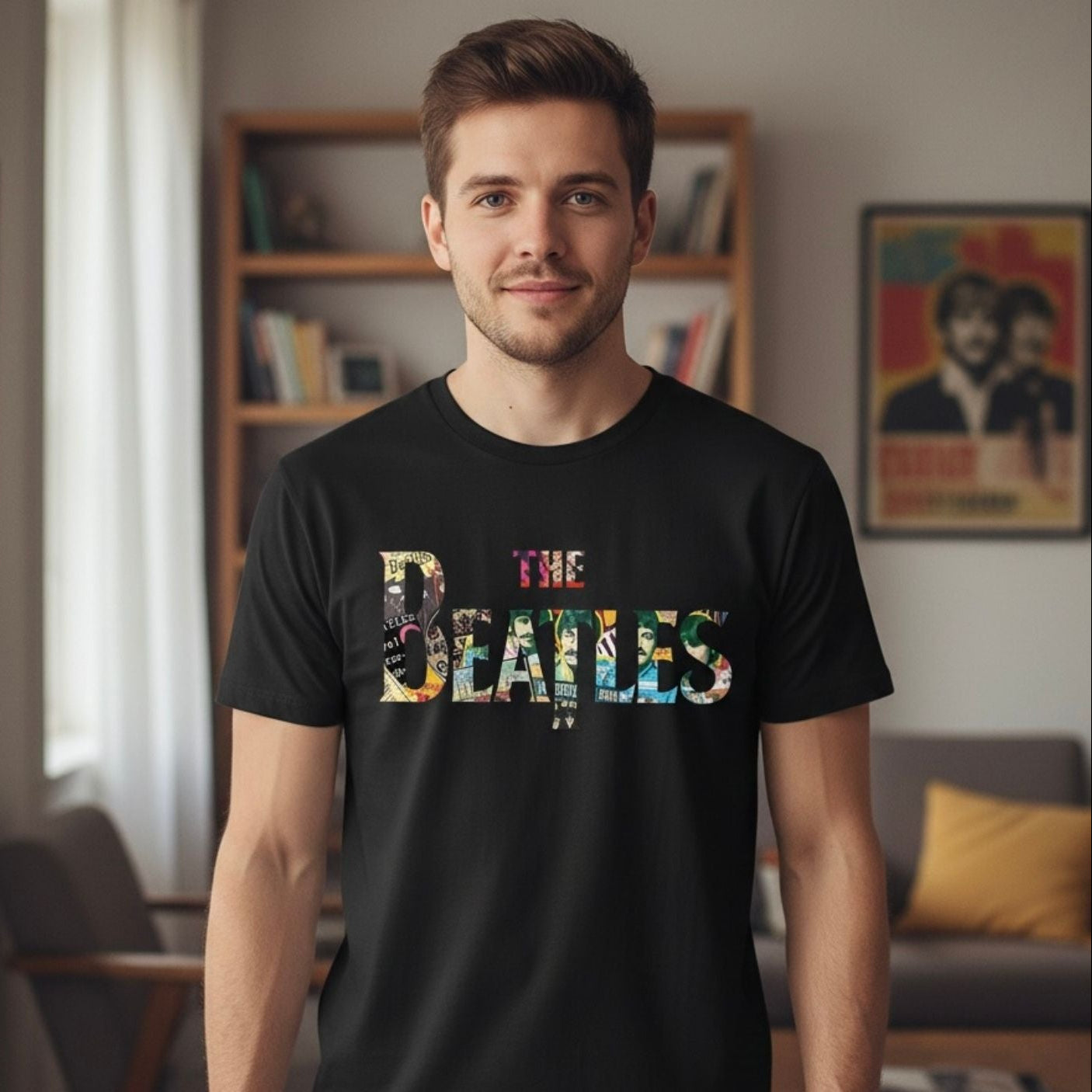 Man wearing a black t-shirt with 'The Beatles' design in a room with bookshelves and a poster.