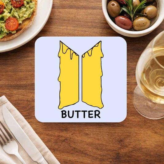 BTS Butter coaster set with golden melting butter logo design styled on wooden dining table – premium K-pop fan home decor, durable drink coaster gift for BTS ARMY collectors