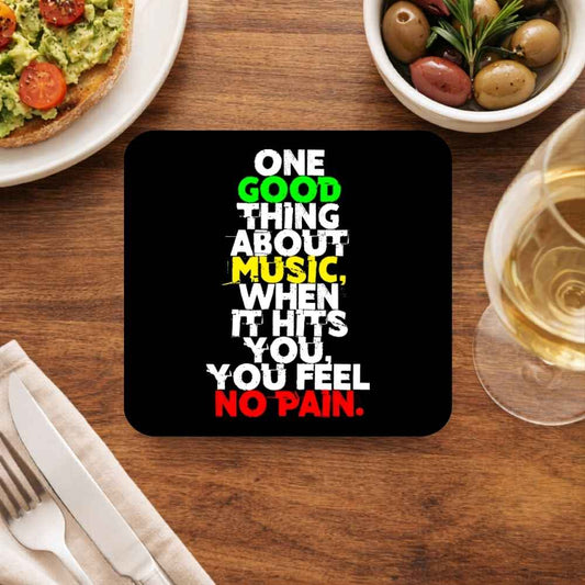 Coaster with a humorous quote on a dining table with food and drink. Bob Marley Gift Merch The Banyan Tee
