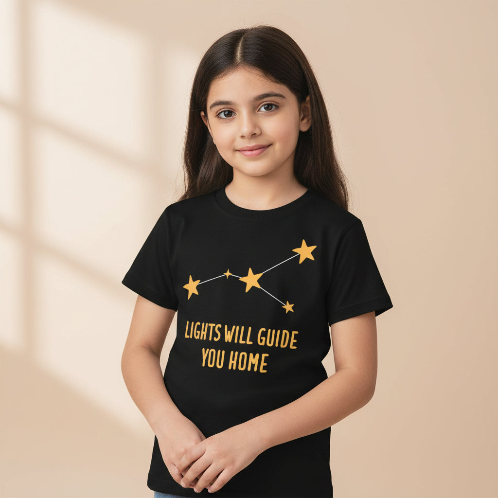 Black t-shirt with yellow star design and text 'LIGHTS WILL GUIDE YOU HOME' on a white background coldplay the bnayan tee 