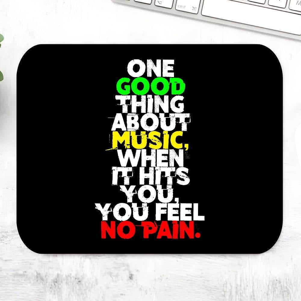 Black mouse pad with colorful text quote on a white surface Bob Marley Gift Merch The Banyan Tee