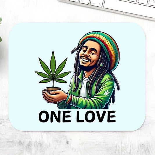 Mouse pad with a graphic of a person holding a cannabis plant and 'ONE LOVE' text on a light blue background. Bob Marley