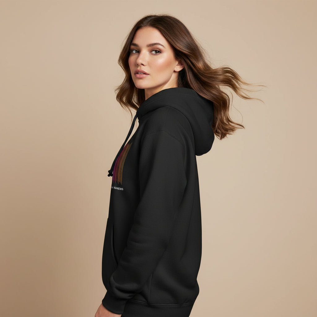 Black hoodie with colorful graphic design on a white background radiohead in rainbows hoodie the banyan tee