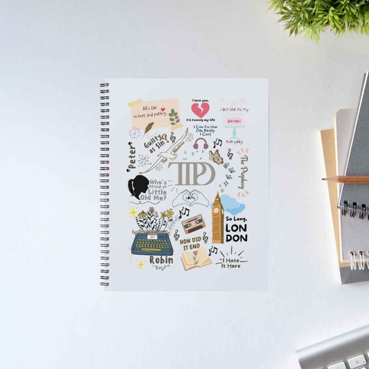 Taylor Swift A Poet's Doodle spiral notebook covered in Tortured Poets Department doodles – a typewriter, Big Ben, a cassette tape and the TTPD logo – on a white cover – The Banyan Tee