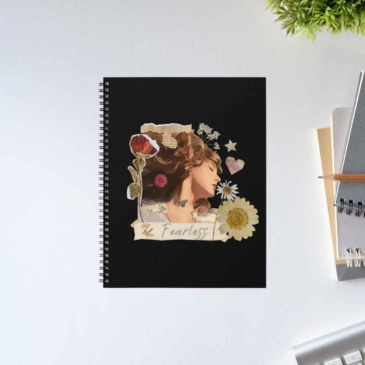 Taylor Swift Fearless spiral notebook with a black cover, a pressed-flower collage, a dreamy profile portrait and a 'Fearless' paper banner – The Banyan Tee