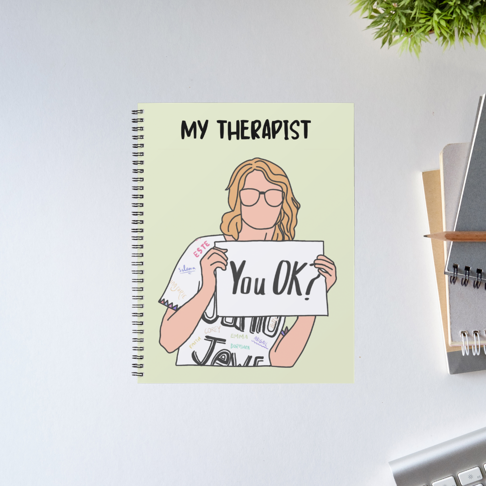 Taylor Swift Junior Jewels spiral notebook with an illustrated faceless figure in glasses holding a "You OK?" sign under the words "My Therapist" on a pale green cover – The Banyan Tee